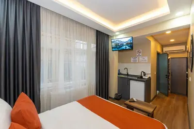 a hotel room with a bed and a sink at hotel La Vitrine in Istanbul