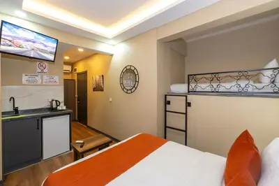 a hotel room with a bed and a kitchen at hotel La Vitrine in Istanbul