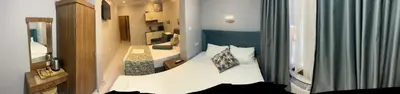 a small bedroom with a white bed in a room at Riverland Suites Apart Hotel in Istanbul