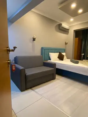 a living room with a couch and a bed at Riverland Suites Apart Hotel in Istanbul