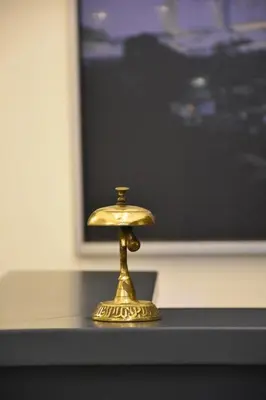 a gold object sitting on a table in front of a monitor at Shishly Palace Hotel in Istanbul