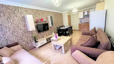 a living room with two couches and a tv at Overland Residence in Istanbul