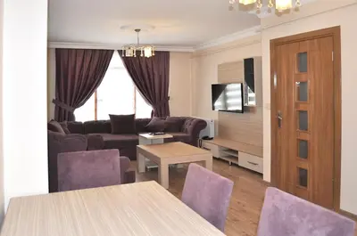 a living room with a couch and a table at Overland Residence in Istanbul