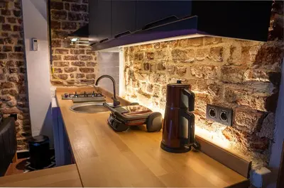 a kitchen counter with a coffee maker on a counter top at Alness Residence in Istanbul