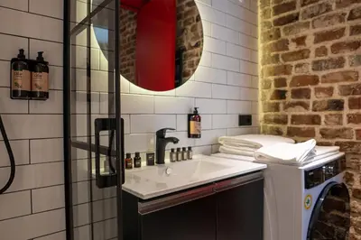 a bathroom with a sink and a mirror at Alness Residence in Istanbul
