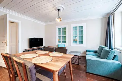 a dining room with a table and a couch at Homie Suites - Historical Apartments in the center of Beşiktaş in Istanbul