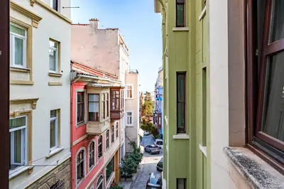 an alley in the city with buildings at Homie Suites - Modern Apartments Nearby Istıklal Street & Galata Tower in Istanbul