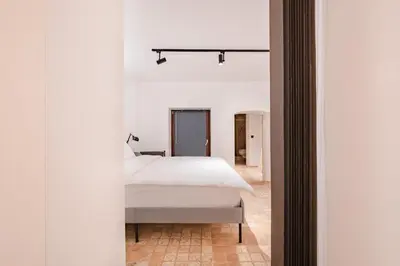 a bedroom with a white bed in a room at Homie Suites - Modern Apartments Nearby Istıklal Street & Galata Tower in Istanbul