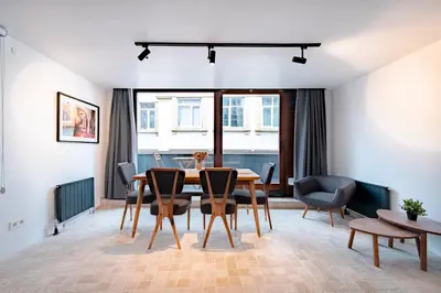 a dining room with a table and chairs at Homie Suites - Modern Apartments Nearby Istıklal Street & Galata Tower in Istanbul