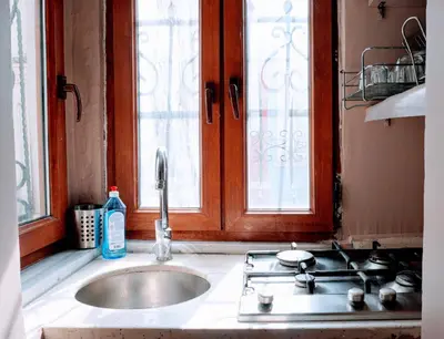 a kitchen with a sink and a window at Stylish apartment in Istanbul