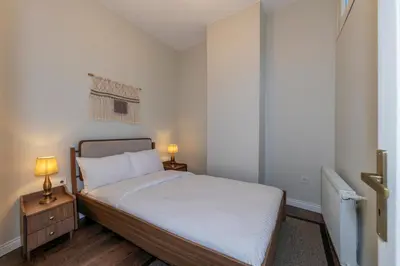 a bedroom with a bed and two lamps on a night stand at CLK Suites Hotel in Istanbul