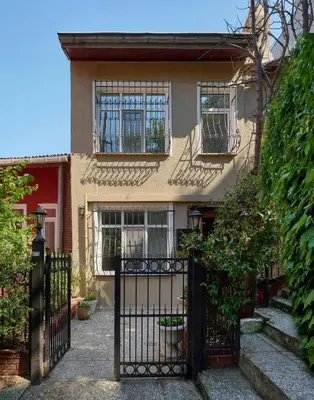 a house with a gate in front of it at Cozy Cute 1 bed1bath Bebek Private Terrace! #75 in Istanbul