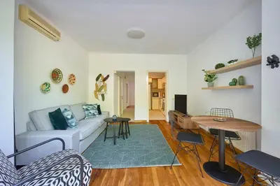 a living room with a couch and a table at Cozy Cute 1 bed1bath Bebek Private Terrace! #75 in Istanbul