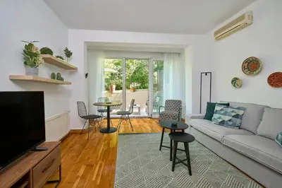 a living room with a couch and a table at Cozy Cute 1 bed1bath Bebek Private Terrace! #75 in Istanbul