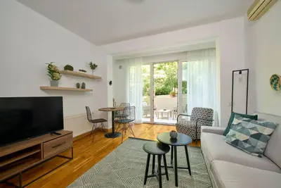 a living room with a couch and a tv at Cozy Cute 1 bed1bath Bebek Private Terrace! #75 in Istanbul