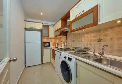 a kitchen with a washing machine and a sink at Cozy Cute 1 bed1bath Bebek Private Terrace! #75 in Istanbul
