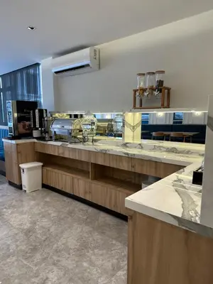 a large kitchen with wooden counters and a counter top at Boutique Dedem Hotel Sultanahmet in Istanbul