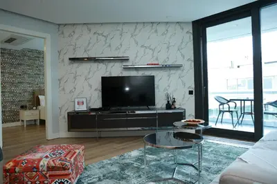 a living room with a couch and a tv at Lovely One Plus One BDROOM-836 in Istanbul