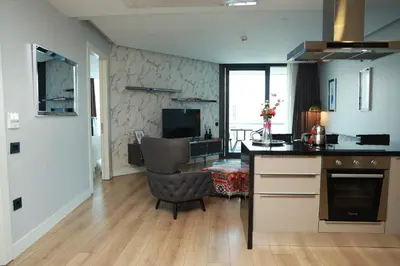 a kitchen with a table and a chair in a room at Lovely One Plus One BDROOM-836 in Istanbul