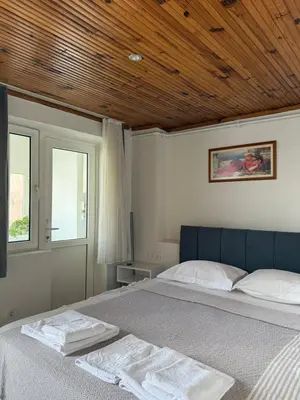 a bedroom with a bed with two towels on it at Güneş House in Istanbul