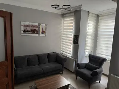 a living room with a couch and a chair at Güneş House in Istanbul