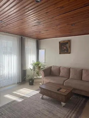 a living room with a couch and a coffee table at Güneş House in Istanbul