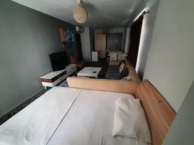 a bedroom with a large bed in a room at İNCİ HOUSE in Kırac