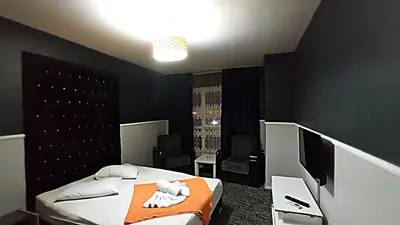 a bedroom with a bed with a towel on it at İNCİ HOUSE in Kırac