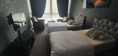 a hotel room with two beds and a window at İNCİ HOUSE in Kırac
