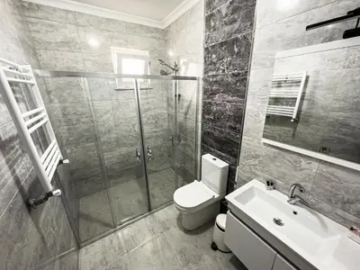a bathroom with a shower and a toilet and a sink at Doğanın Kalbindeki Eviniz-6 Kişi in Gemlik