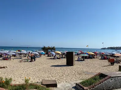 a group of people on a beach with umbrellas at Doğanın Kalbindeki Eviniz-6 Kişi in Gemlik