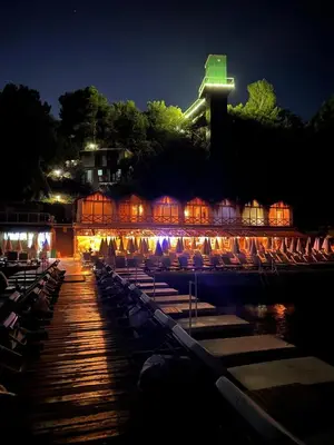 a group of chairs on a dock at night at The Roof Ada in Adalar