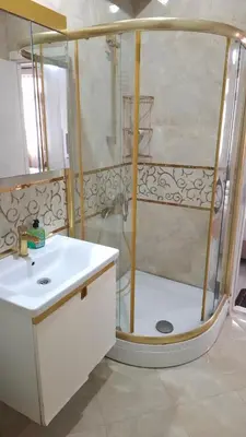 a bathroom with a shower with a white sink at Halil Bey Konağı in Istanbul