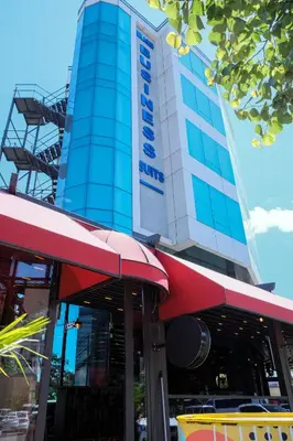 a building with a red awning in front of it at Brand Business Hotel in Corlu