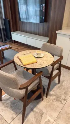a table with two chairs and a table with a plate at La Mia Suites in Istanbul