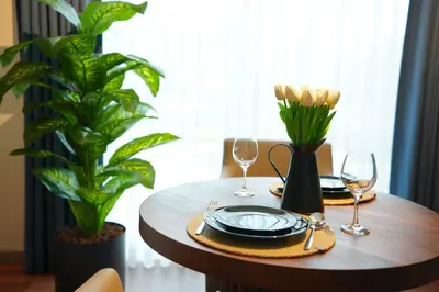 a wooden table with glasses and plates on it at Vanilla 11 in Istanbul