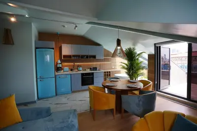a kitchen and dining room with a table and chairs at Vanilla 11 in Istanbul