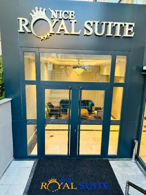 a store front with a royal suite sign on the door at Nice Royal Cıty in Istanbul