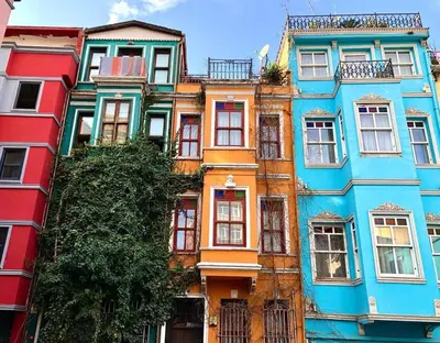 a row of colorful buildings in a city at Balat Historical House in Istanbul