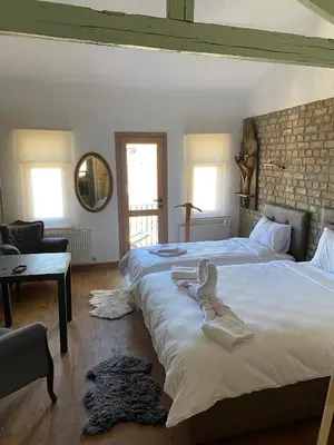 a bedroom with two beds with towels on them at Balat Historical House in Istanbul