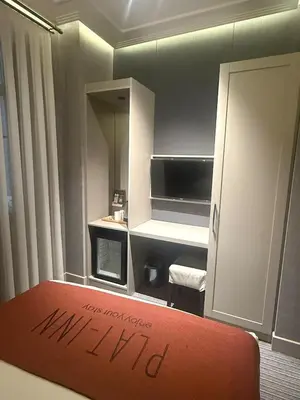 a room with a kitchen with a sign that says milmond at Union Hotel Plat Inn -Special Category in Istanbul