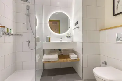a bathroom with a sink and a shower at Hampton By Hilton Cerkezkoy in Tekirdag