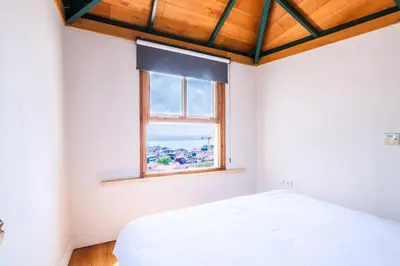 a bedroom with a white bed and a window at Homie Suites - Historical Apartment Nearby Galata Tower in Istanbul