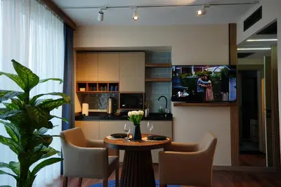 a kitchen and dining room with a table and chairs at Dream house 22 in Istanbul