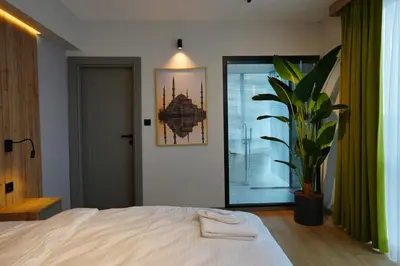 a bedroom with a bed and a potted plant at Dream house 22 in Istanbul