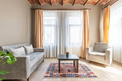 a living room with a couch and a chair and a table at Bdino Boutique Hotel in Istanbul