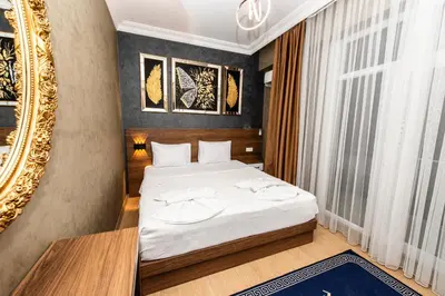 a bedroom with a bed and a mirror at Blue Vista Houses & Spa in Esenyurt