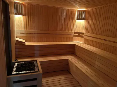 a sauna with a bench in the middle of it at Blue Vista Houses & Spa in Esenyurt