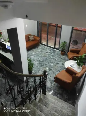 a living room with couches and a table at TAKSİM GOKOTTA SUiTE in Istanbul