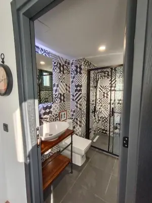 a bathroom with a tub and a sink and a shower at Karaköy in Karaköy Hotel in Istanbul